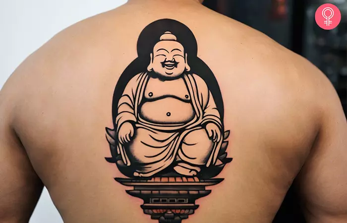 Laughing Buddha tattoo on the back of a man
