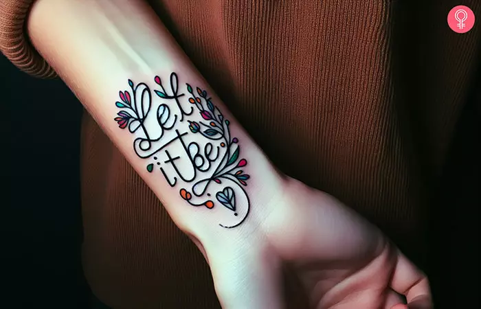 A let it be wrist tattoo with a small heart