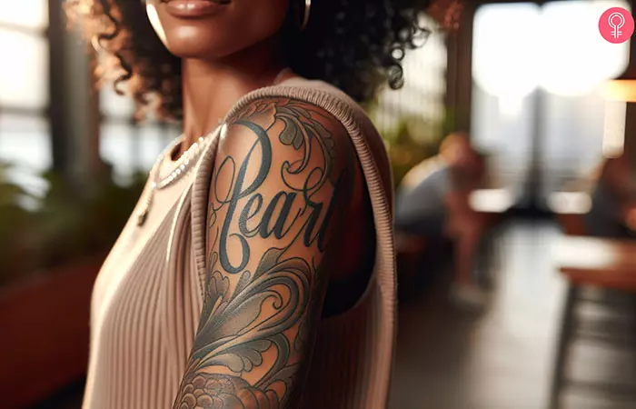 A stylish tattoo of the name “Pearl”
