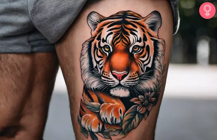 A man with a male tiger tattoo on the thigh