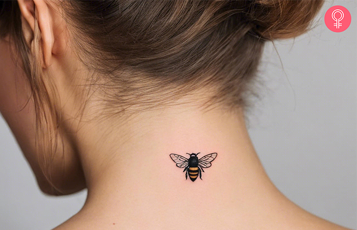  A small bumble bee on the back of the neck