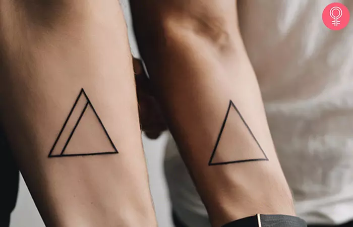 Couple with matching triangle wedding tattoos on their wrists