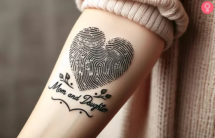 Mother and daughter with fingerprint tattoo design on the forearm