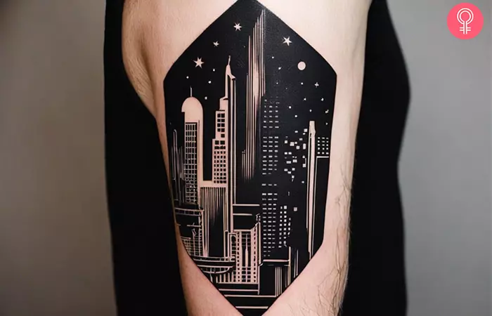 Negative space blackout tattoo of a cityscape at night