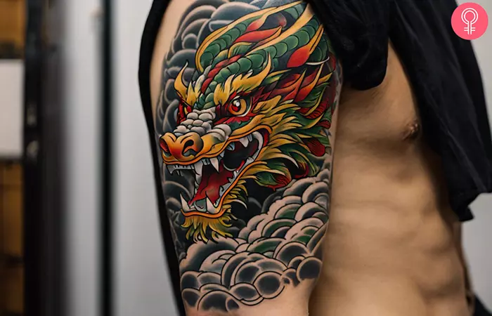 Neo-traditional Japanese dragon tattoo on the upper arm of a man