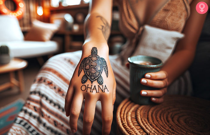 Ohana turtle tattoo design on the hand of a woman