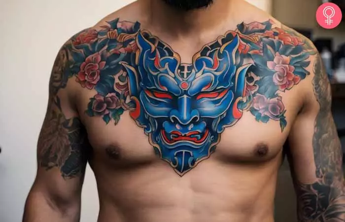 A man with an Oni mask chest tattoo