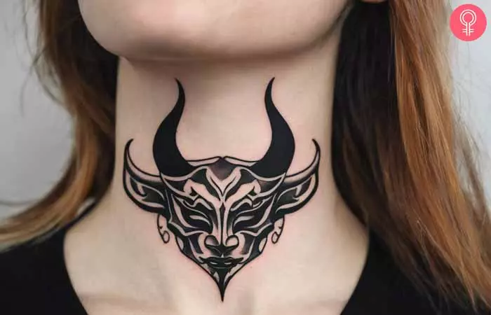  A woman with an Oni mask neck tattoo