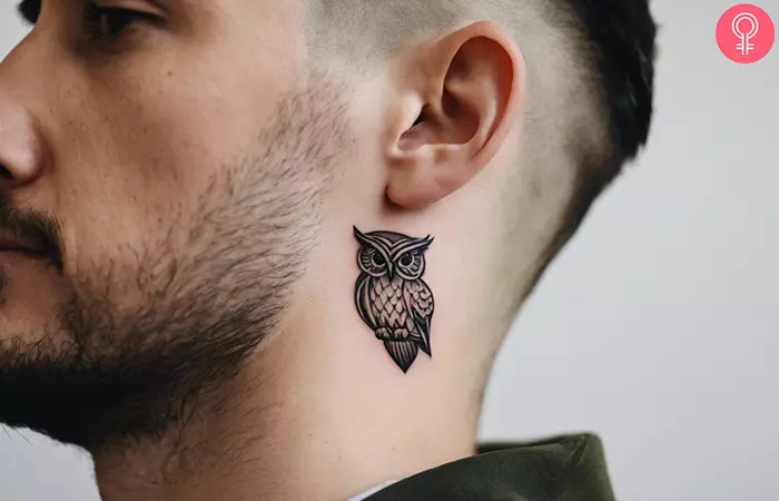 Owl tattoo on the neck of a man
