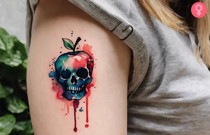 Poisoned apple tattoo on the forearm