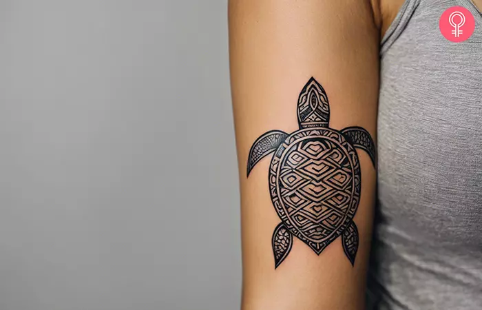 Polynesian turtle tattoo on the arm
