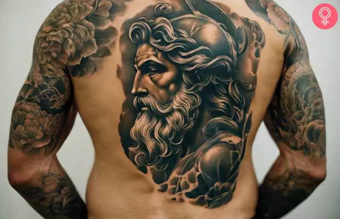 Poseidon face tattoo on the back
