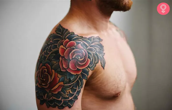 A man sporting a quarter sleeve tattoo on his upper arm