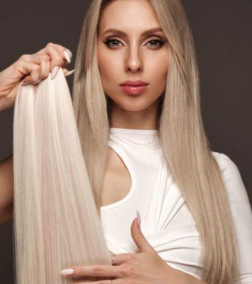 A woman with blonde hair and blonde hair weave extensions in her hand.