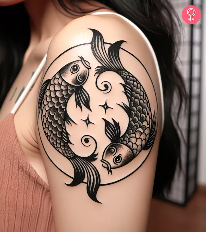 A woman with a Pisces symbol tattoo on her shoulder