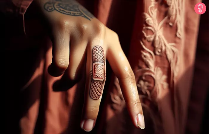 A realistic band-aid tattoo on the finger