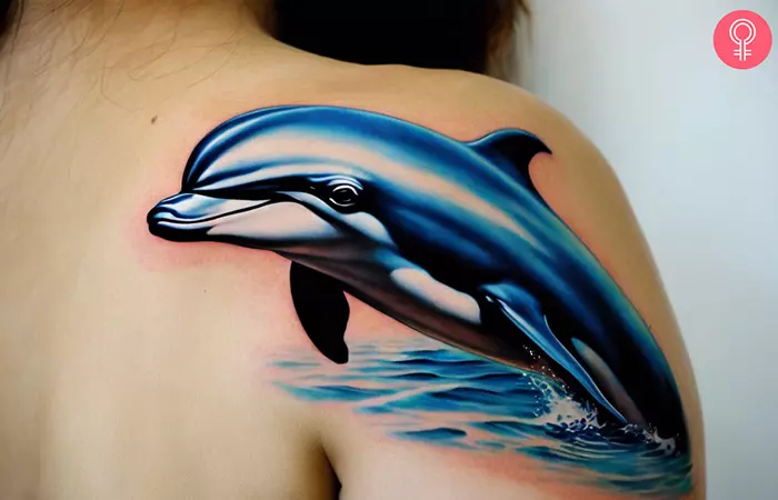 Realistic dolphin tattoo on the shoulder