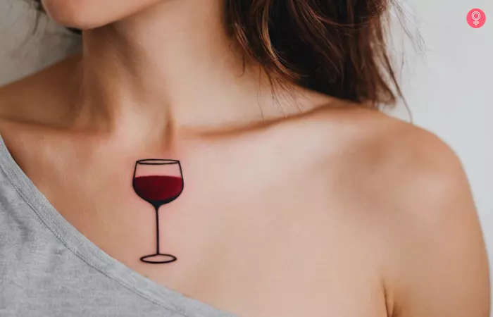 Red wine tattoo near the collarbone