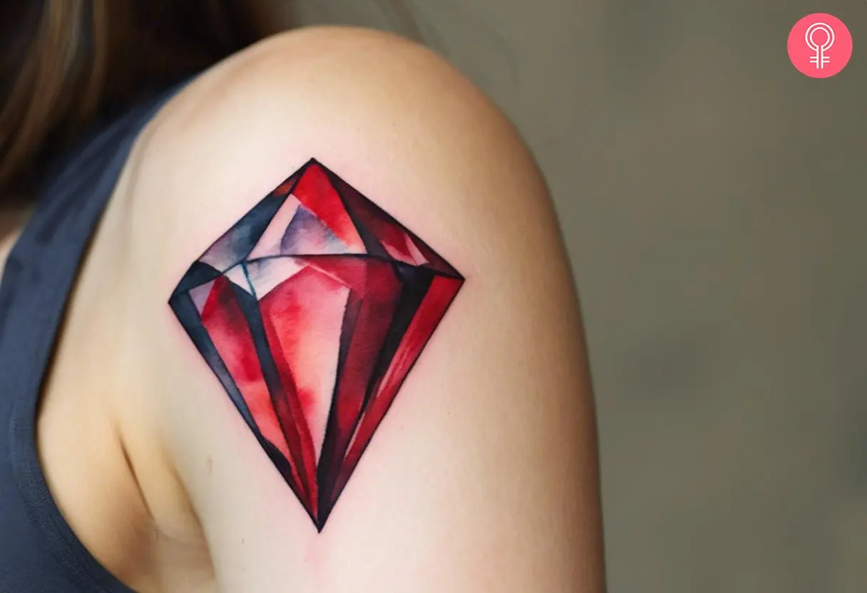 Red diamond tattoo on a woman’s upper arm