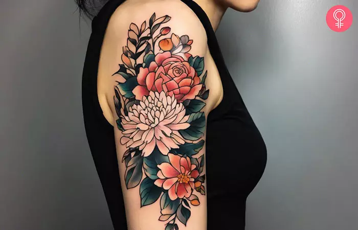 A rose and chrysanthemum tattoo on the upper arm