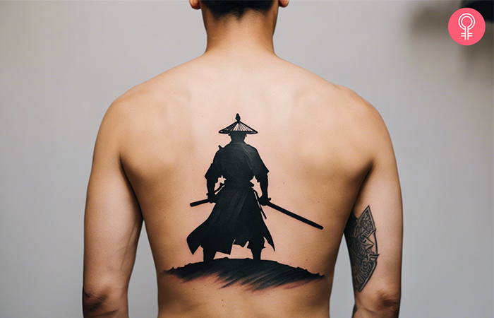 Man with samurai sword tattoo on his back