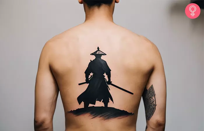 Man with samurai sword tattoo on his back