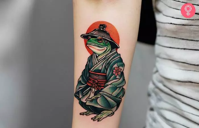 Samurai frog tattoo on a woman’s forearm