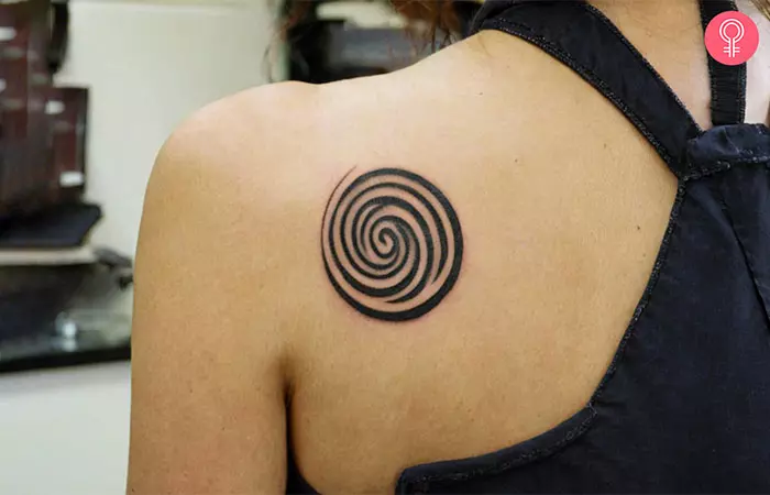  A Celtic spiral growth tattoo on the shoulder