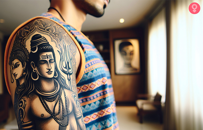 A Shiva and Shakti tattoo on a man’s upper arm