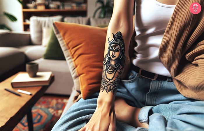 A Shiva tattoo for girls on a woman’s upper arm