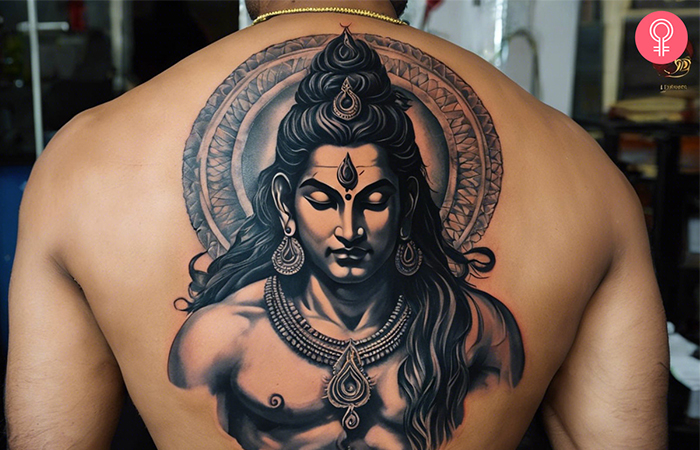 A man with a Shiva tattoo on his upper back