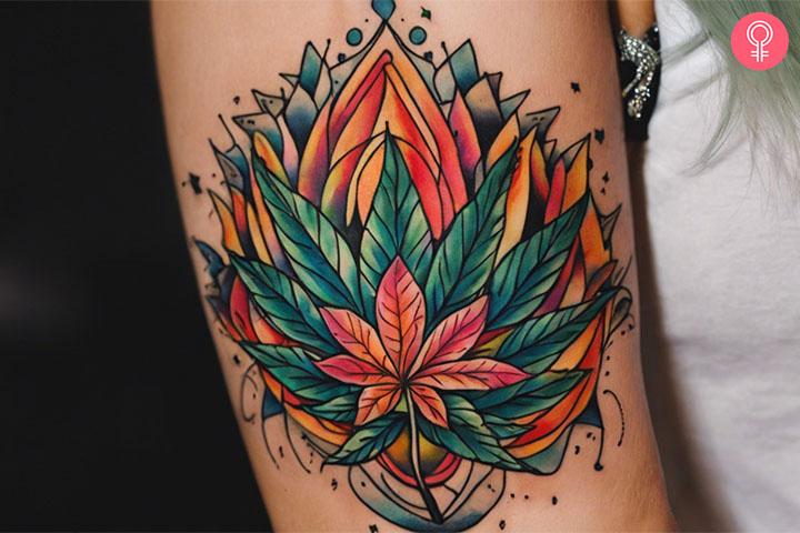 A woman with a trippy cannabis leaf tattoo on her upper arm