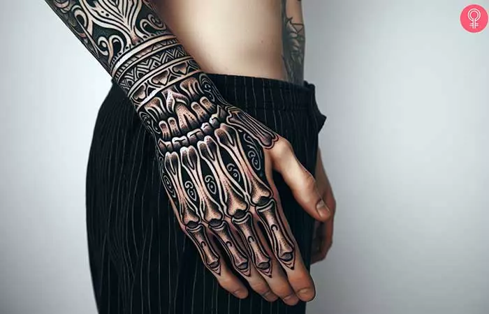 A man with an ornamental skeleton hand tattoo