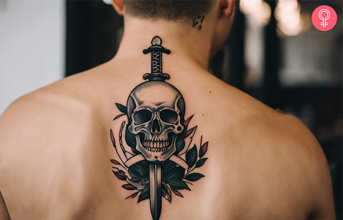 A man with skull and sword tattoo on his back