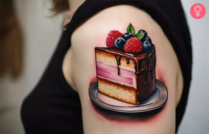Slice of cake tattoo on the upper arm