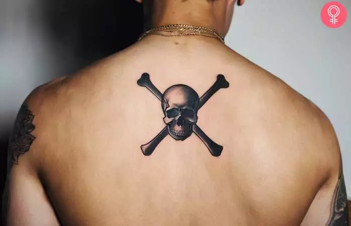 A man with a small back tattoo
