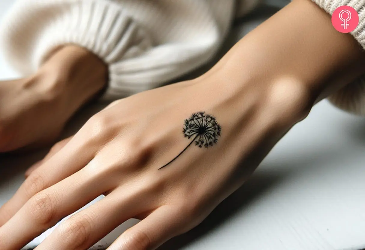 Small Dandelion tattoo on the hand of a woman