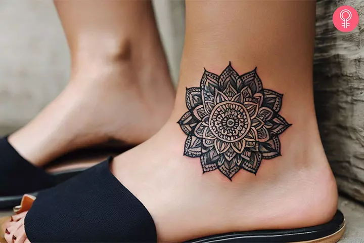 A woman with a small trippy tattoo design on the ankle