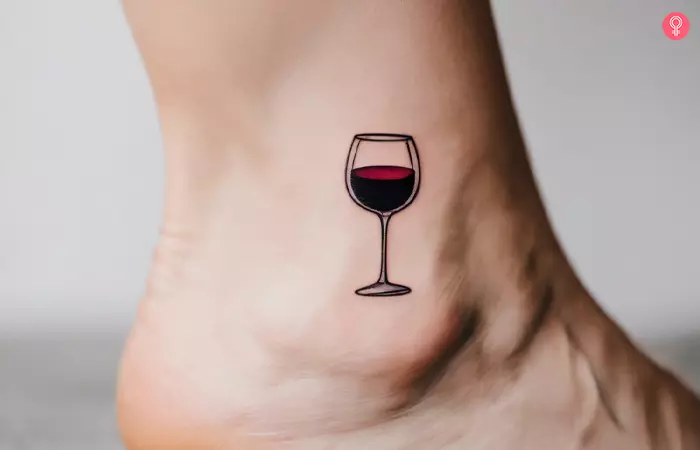 Small wine glass tattoo on the ankle