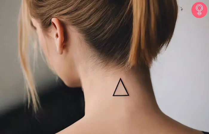 Small triangle tattoo on the back of the neck