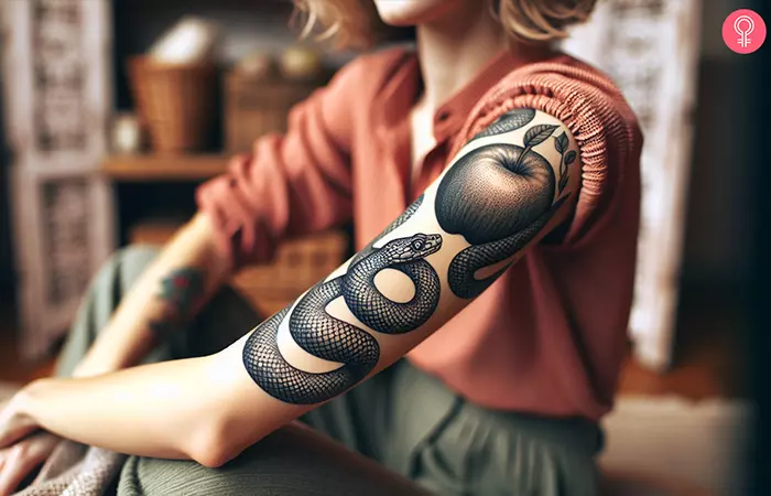 Snake and apple tattoo on the arm