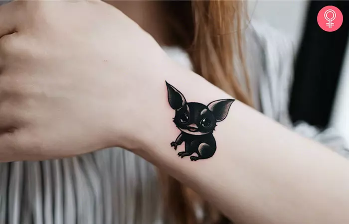 A soot gremlin tattoo on the wrist