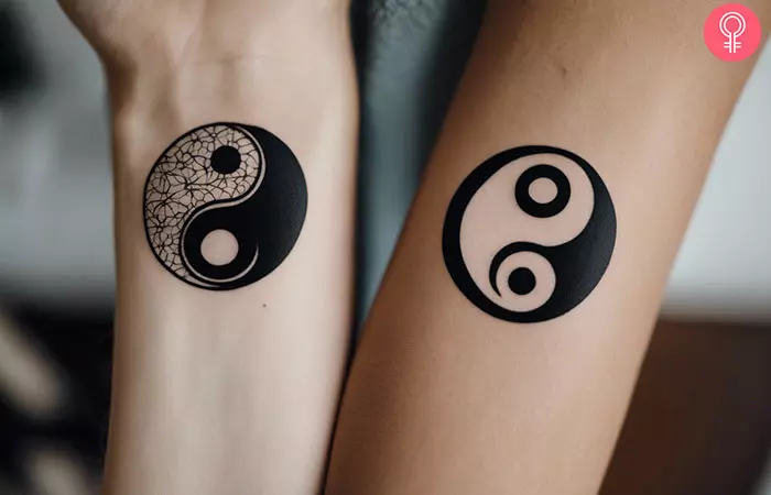 A couple with soulmate yin yang tattoos on the wrist and forearm