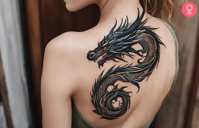 Spiral dragon tattoo on the upper back