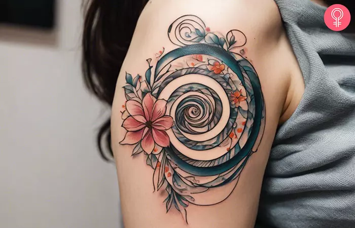 Spiral flower tattoo on the upper arm