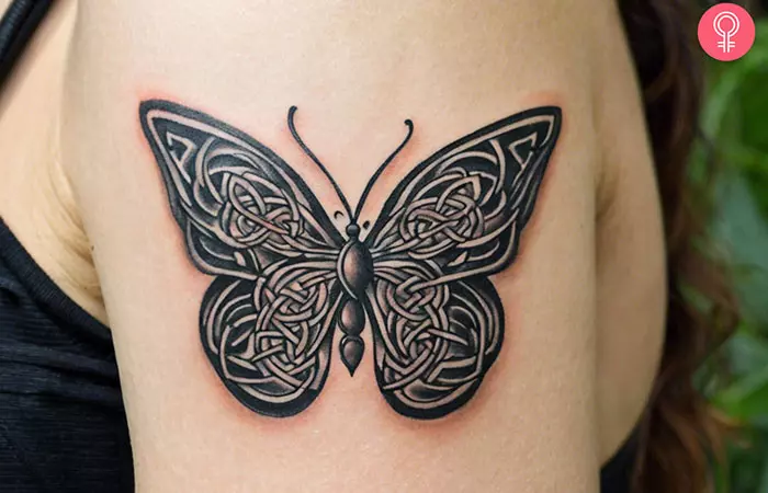 Spiritual butterfly tattoo on the arm of a woman