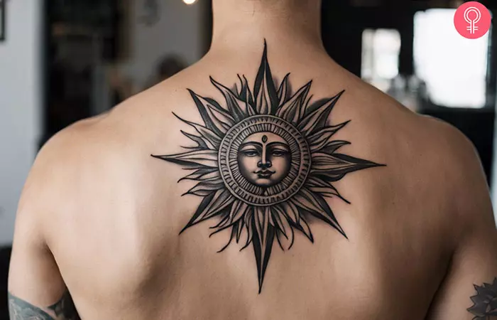 Spiritual sun tattoo on the back of a man