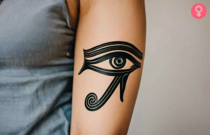 A woman with an ‘Eye of Ra’ tattoo on her inner arm.