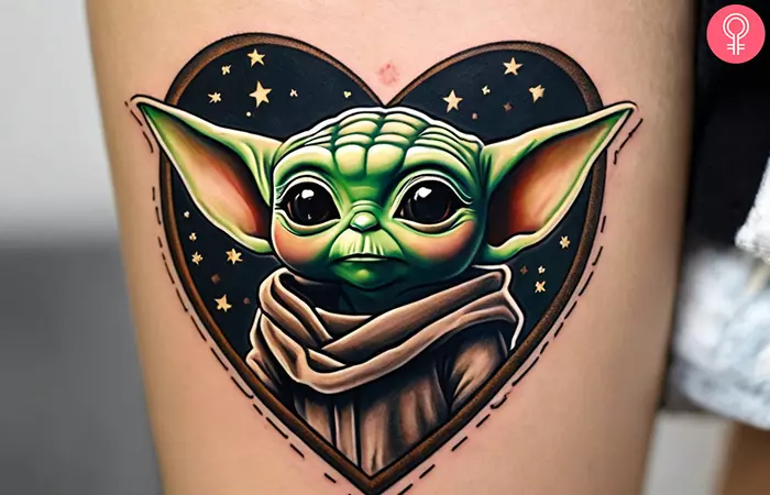 Stars and heart Baby Yoda tattoo on the arm
