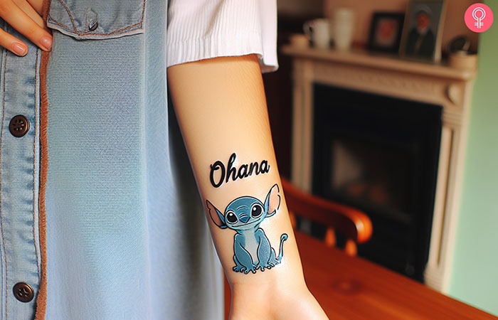 Stitch Ohana tattoo design on the lower arm of a woman